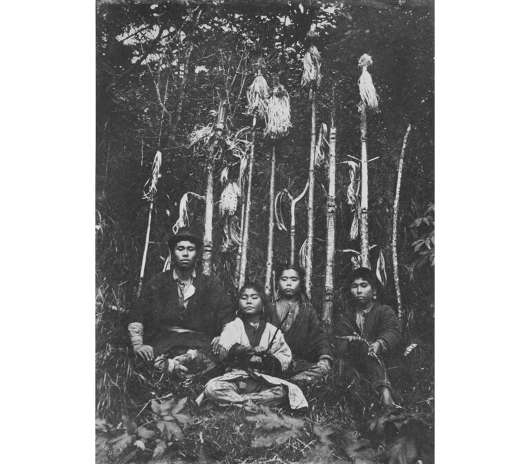 アイヌ新法は北朝鮮工作員が作ったという恐るべき闇 Boy in Formal Costume and Three Young Men in Informal Costume By Altar of Inau (Offerings to Gods) in Sakhalin Island.